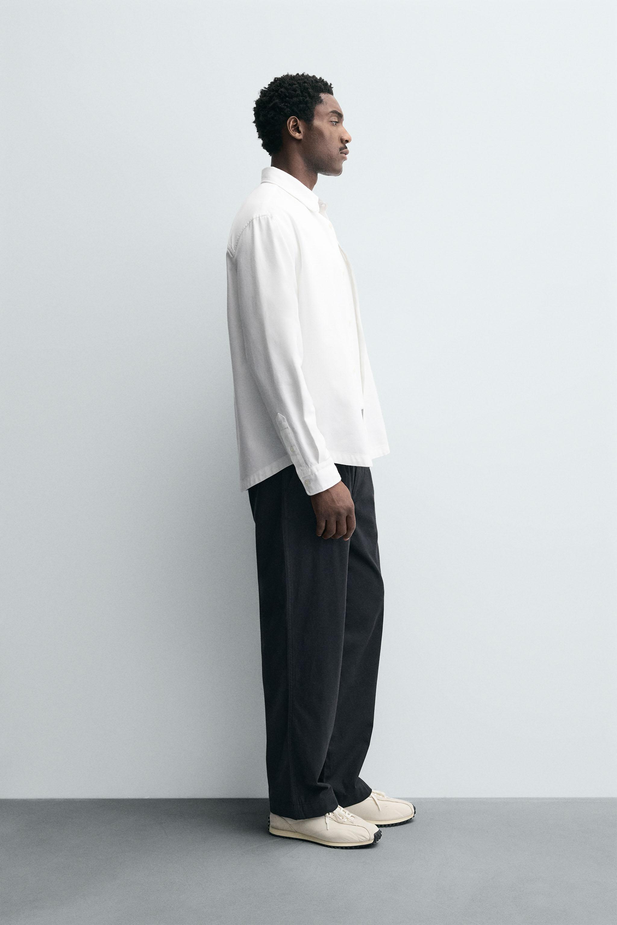 RELAXED FIT PLEATED PANTS